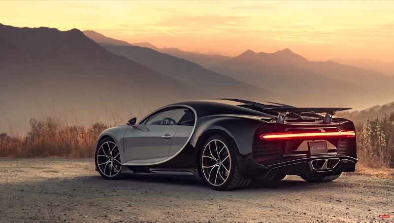 A black sports car parked on a desert hill at sunset to demonstrate the completion portion of the student development metaphor.